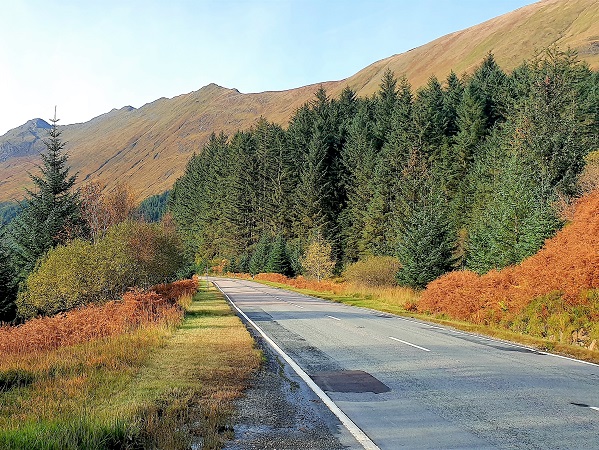 Road through the mountain in Scotland Mountains of Scotland in autumn